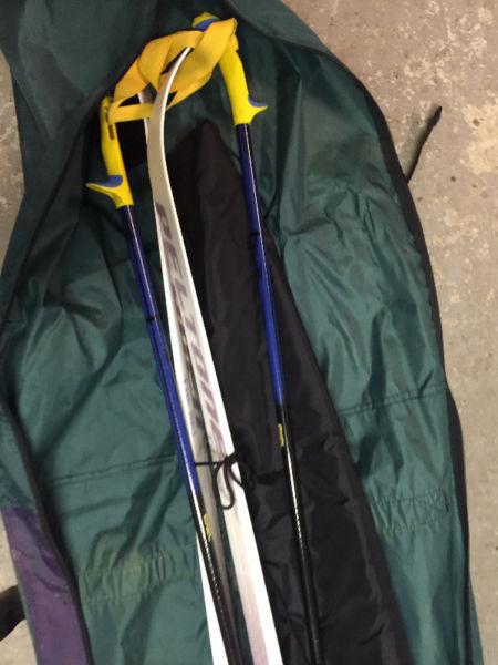 Skis, boots(size 8), poles, bag