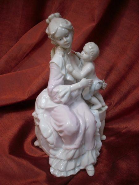 Lovely porcelain German figurine of a Mother with Baby