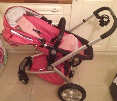 Pink stroller with car seat