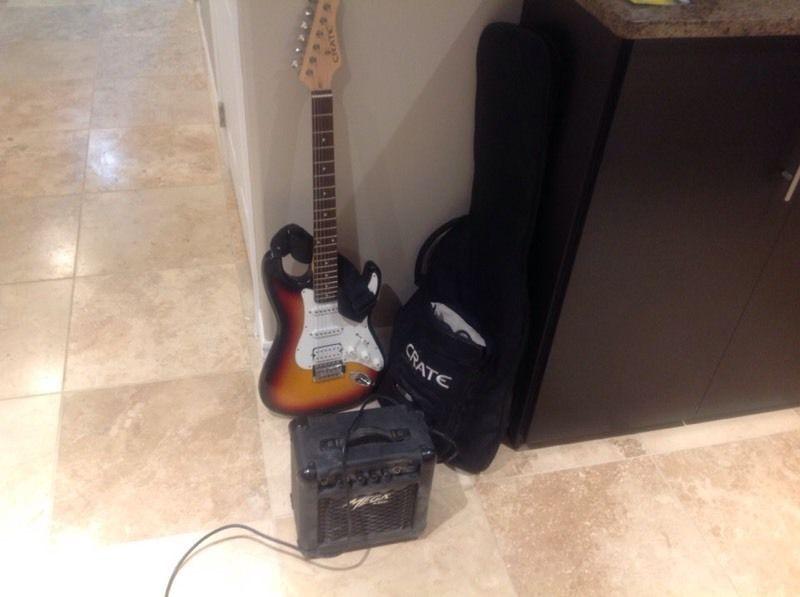 Electric guitar with amp speaker and microphone