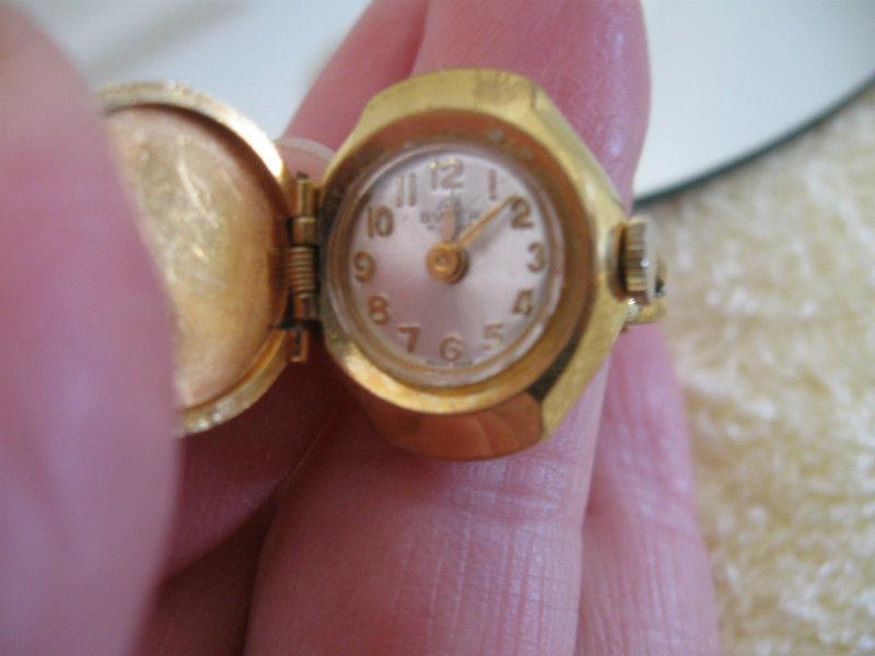 CLASSIC ADJUSTABLE GOLDTONE WATCH / RING..[NON-WORKING]