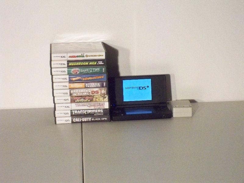 Black Nintendo DSI with games and charger