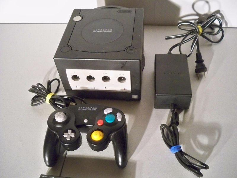 Black Nintendo Gamecube with one controller, Cars game, etc