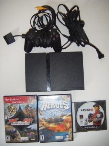 Playstation 2 slim with 3 games for sale