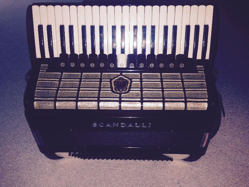 Excellent four chamber Scandalli full size accordion