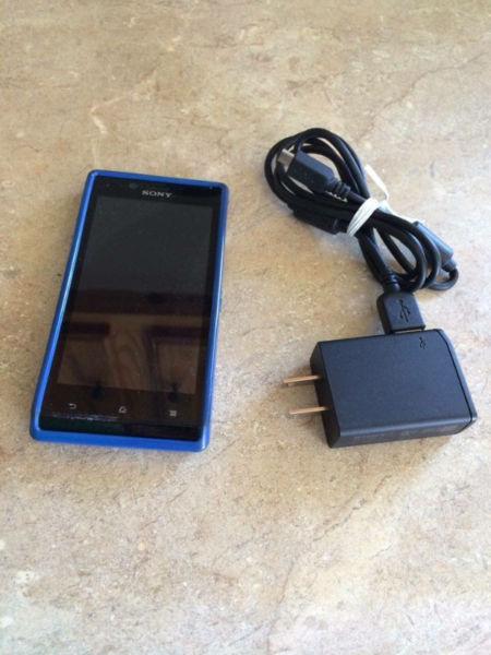 Sony Xperia cell phone with charger and case