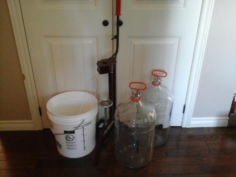 glass carboy/ corker