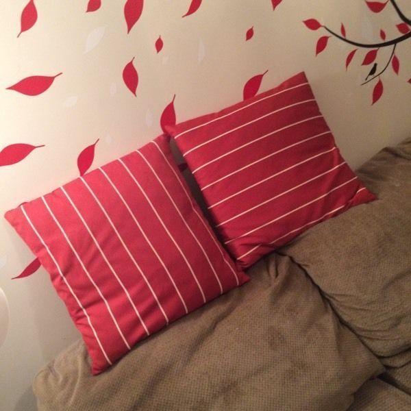 2 large red and white striped pillows