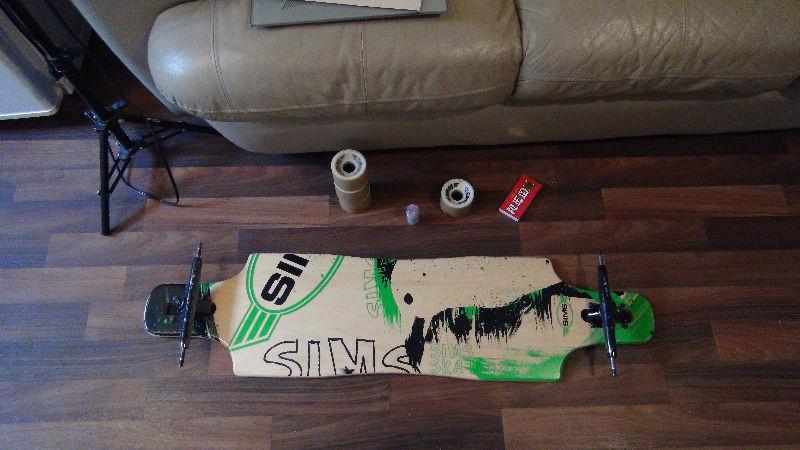 Complete longboard BARELY used, and bones super bearings