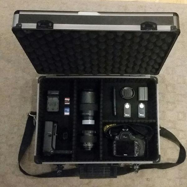 Nikon D90 with 28-80mm and 70-300mm lenses, all accessories
