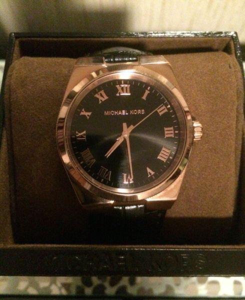 Barely worn Michael Kors Rose Gold Watch with box. Worth over $
