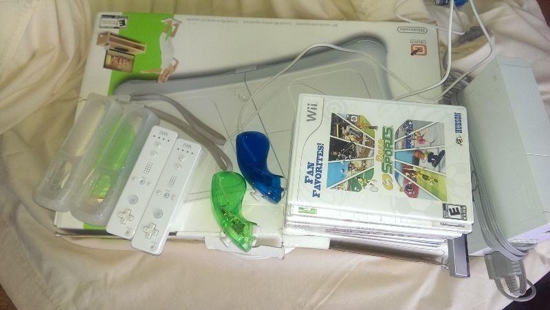 The Whole Wii Kit and kaboodle with 7 games