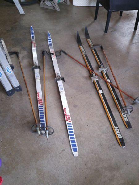 2 pairs of cross country skis & poles