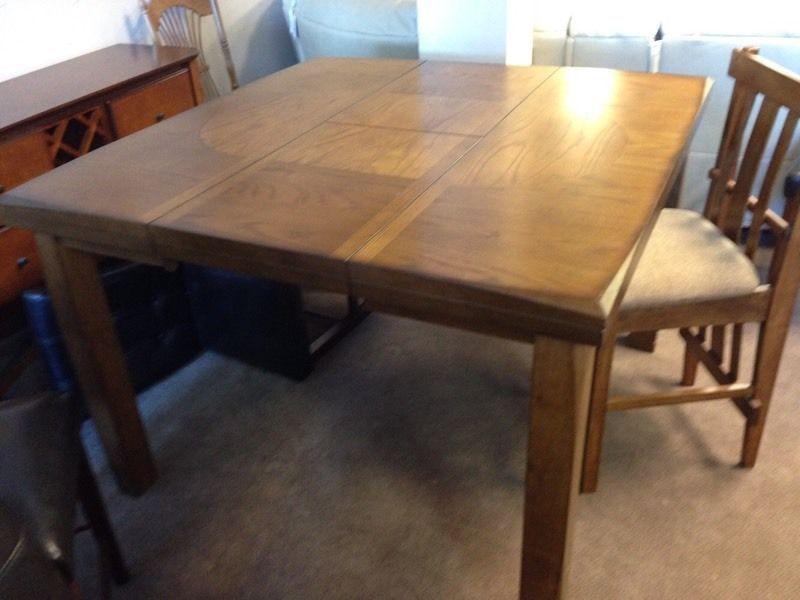 New pub height oak dining table with four matching stools $800