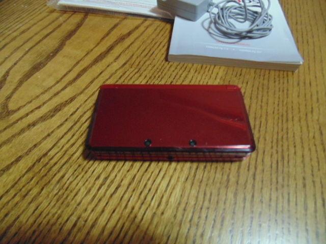 Red Nintendo 3DS in excellent condition with all the stuff