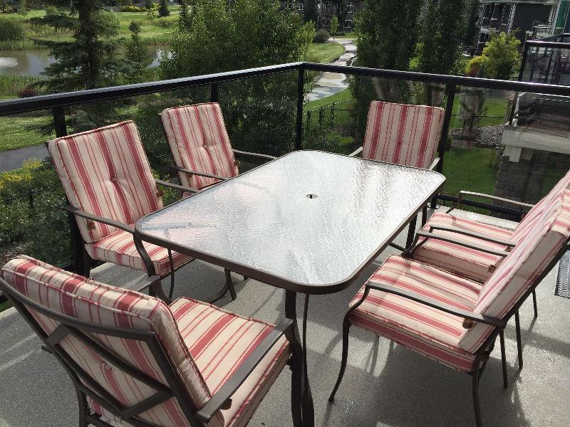 Patio dining glass top table with 6 chairs