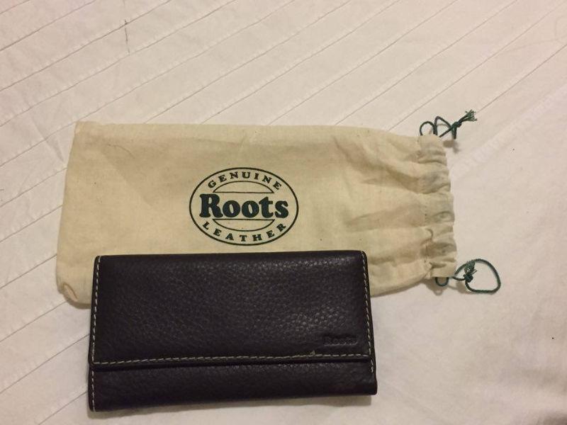 BRAND NEW LEATHER WALLET BY ' ROOTS ' FOR SALE