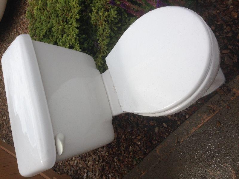 American Standard toilet with lid. White