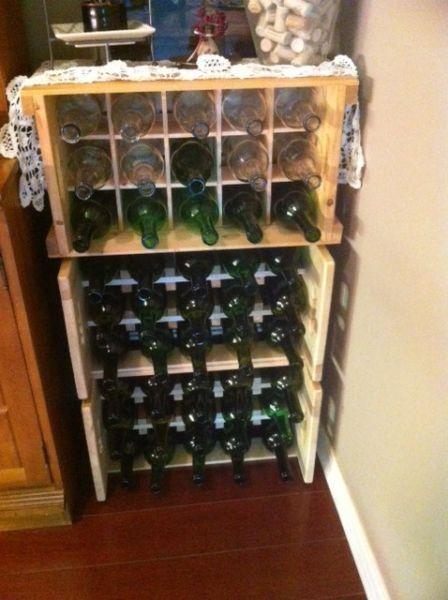 4 wooden wine crates filled with empty clean wine bottles