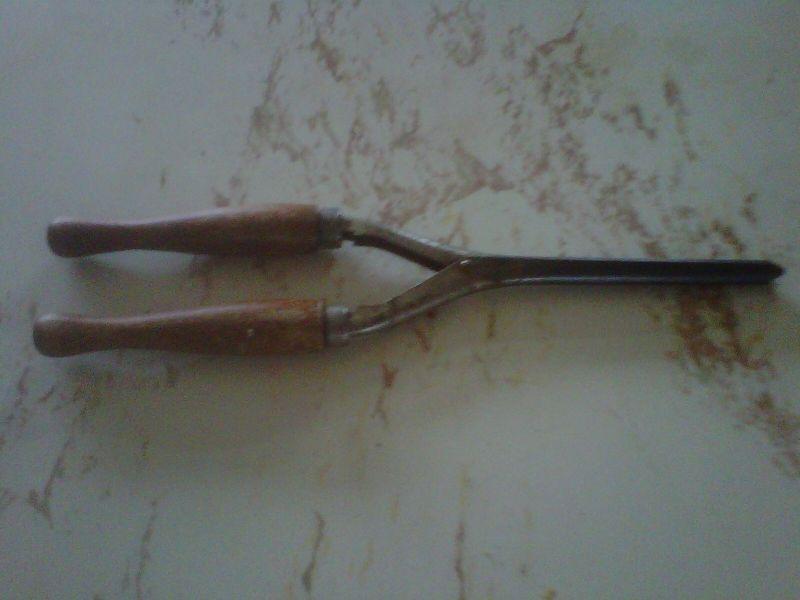 small antique hair curling iron, wooden handle