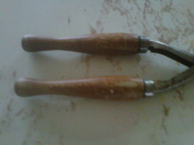 small antique hair curling iron, wooden handle