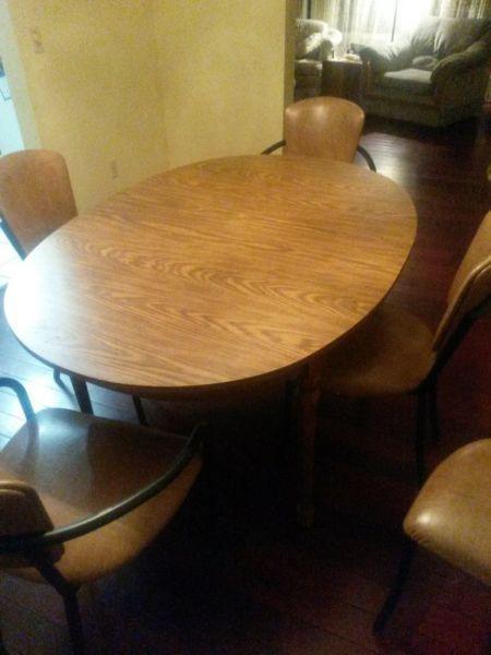 extendable wooden table with 6 padded chairs