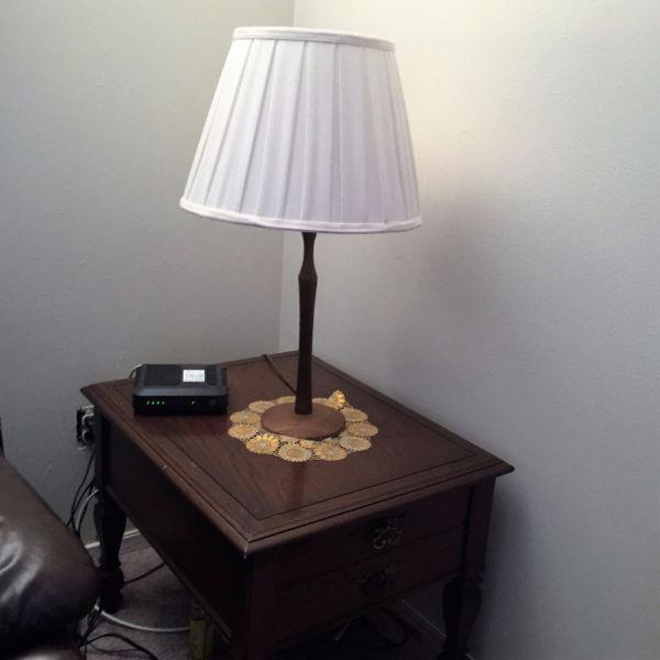 wooden corner table with decorative lamp