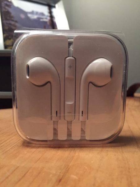 Apple Headphones in plastic wrap