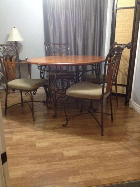 Ashley brand dining table and four chairs