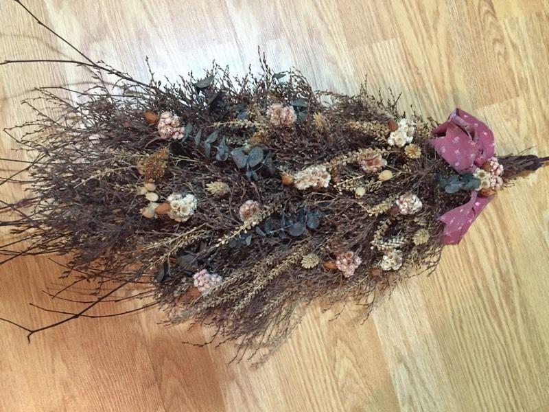 Two dried flower arrangements