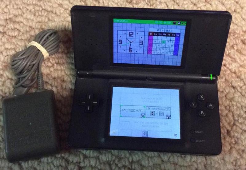 Nintendo DS With Charger and 8 Games!