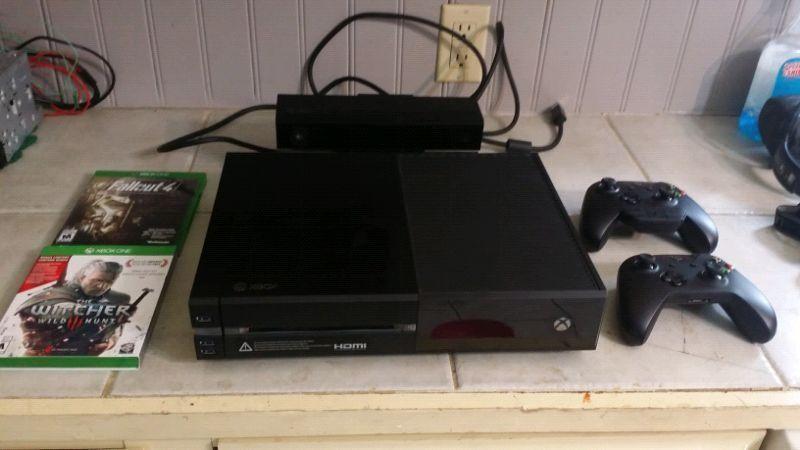 1TB Xbox One, 2 controllers, 6 games, and headset adapter