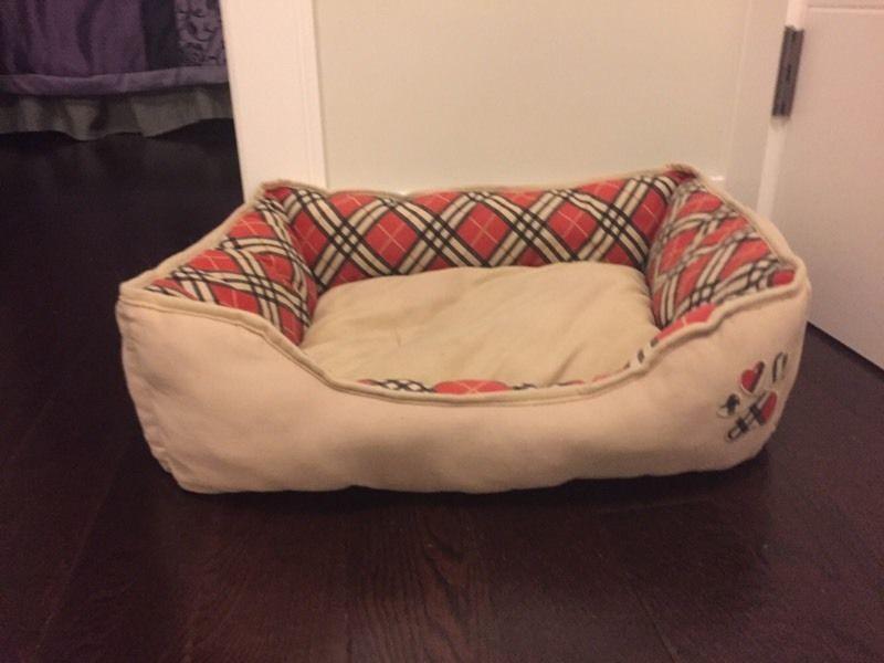 Tan and red dog bed