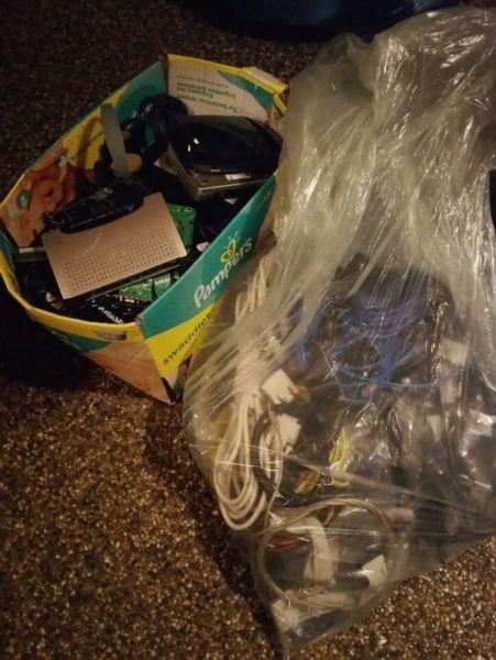 Bag of cables and boxes of dead/unused tech