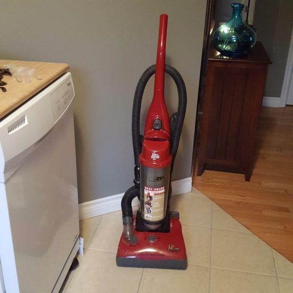 Dirt devil stand up vacuumed with canister
