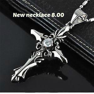 skull wing necklaceand wolf tooth 1 black and 1 blue 2 cross new