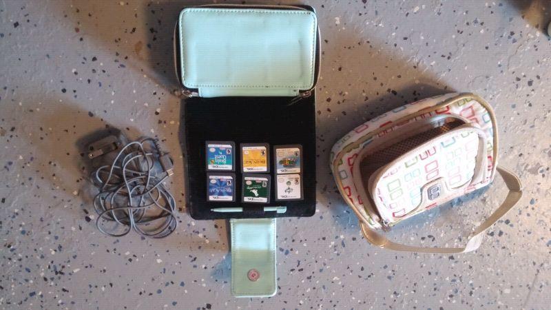 Blue Nintedo DS Lite with case, charger, purse, and 6 games