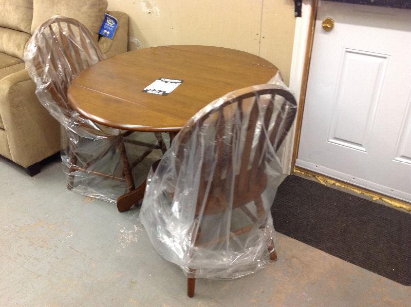 Brand new 3 piece dining set with side leaf...taxes in!