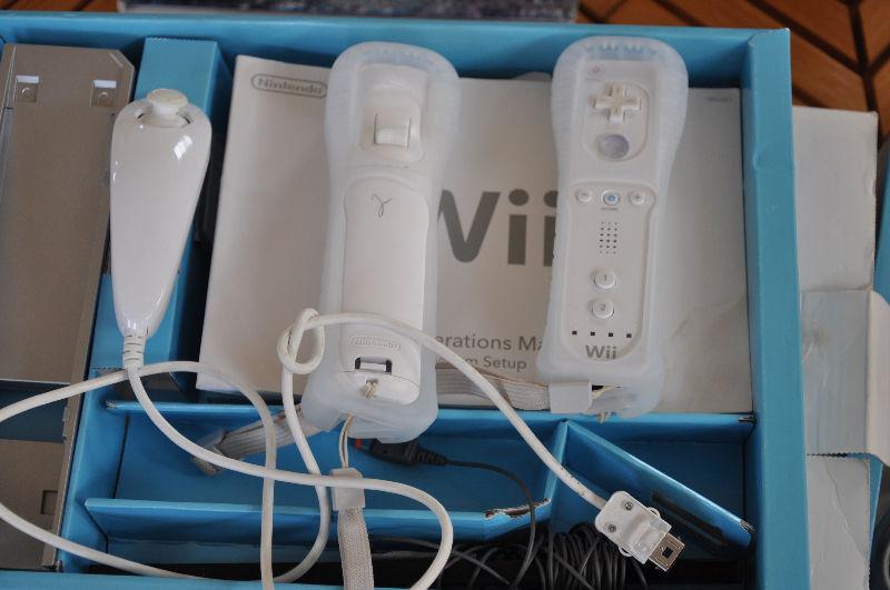 WII CONSOLE WITH, JOEY AND TWO HAND HELD STICKS