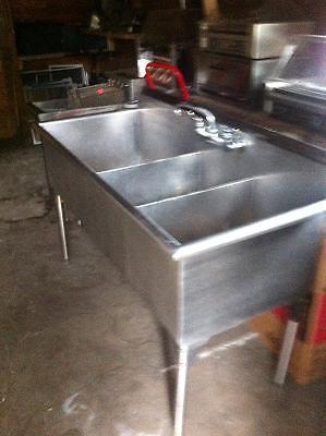 Deep fryers an garland pizza oven an a triple sink