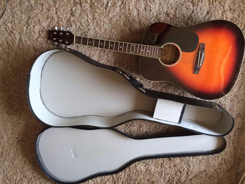 Traditional acoustic guitar with case