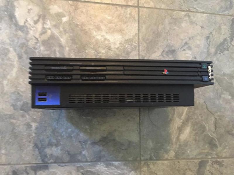 Black PS2 comes with two controllers & all cords