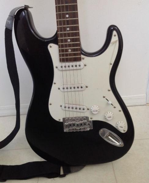 Academy Electric guitar. Stays in tune, and sounds great