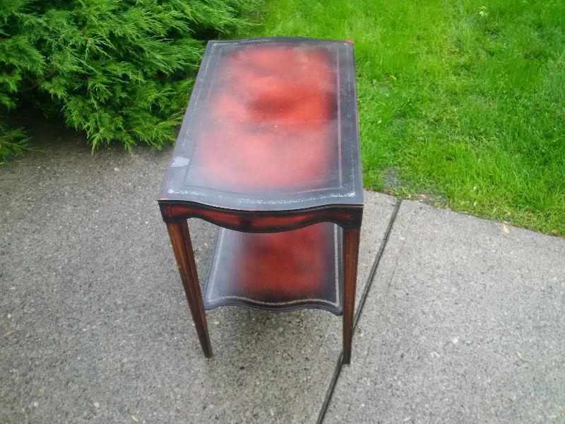 Antique leather end table $30. Needs a bit of TLC. Needs to be g