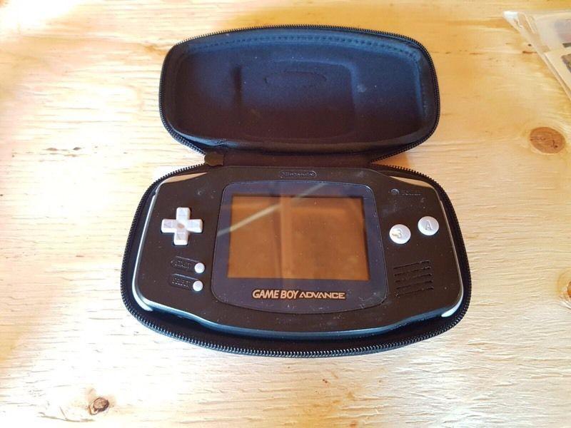 Black Gameboy advanced with 4 games and accessories