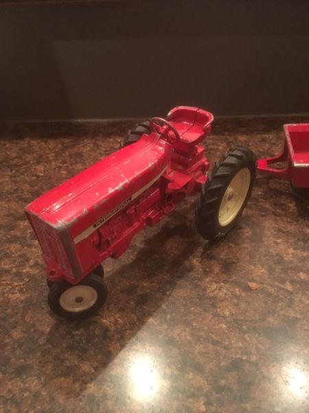 Massey Ferguson toy tractor and Tonka trucks