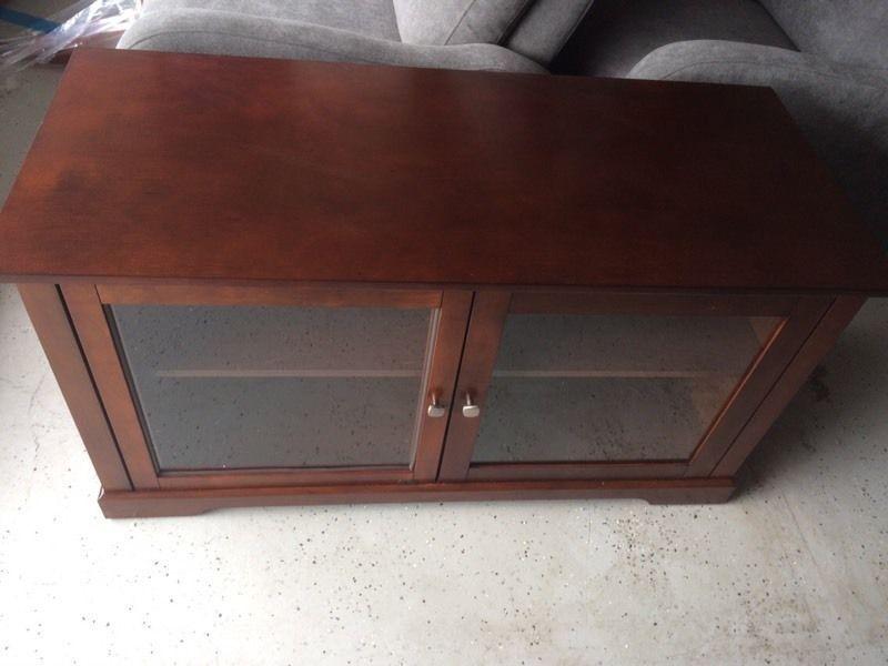 Like new wooden TV cabinet with 2 adjustable shelves