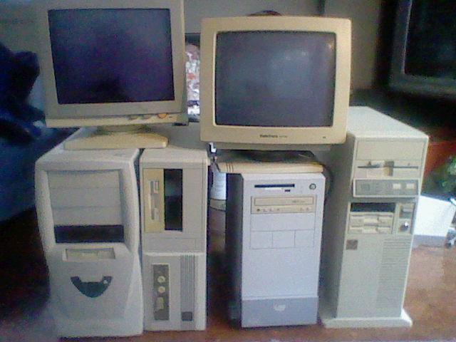 bunch of vintage collectible computer towers and monitors