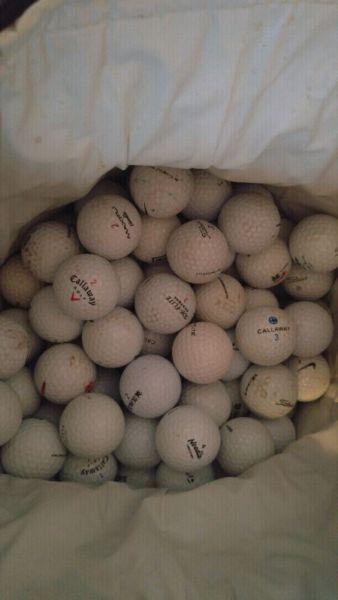 Bags of various golf balls