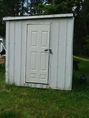 Metal shed with shelving